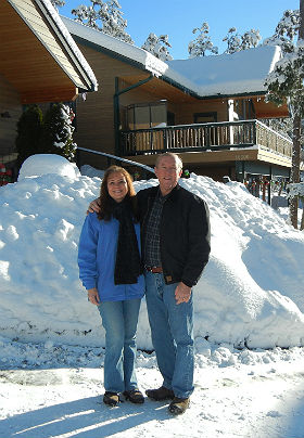 Exterior view of Inn and Innkeepers surrounded by fresh, white snow and clear blue skies.